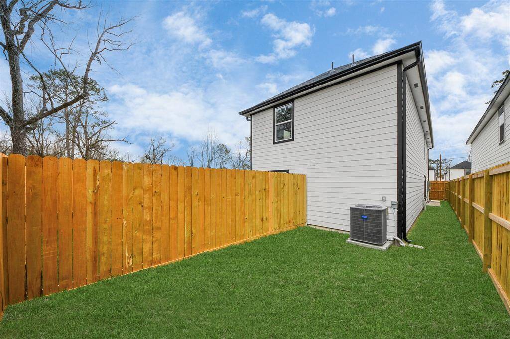 The backyard has plenty of green space.