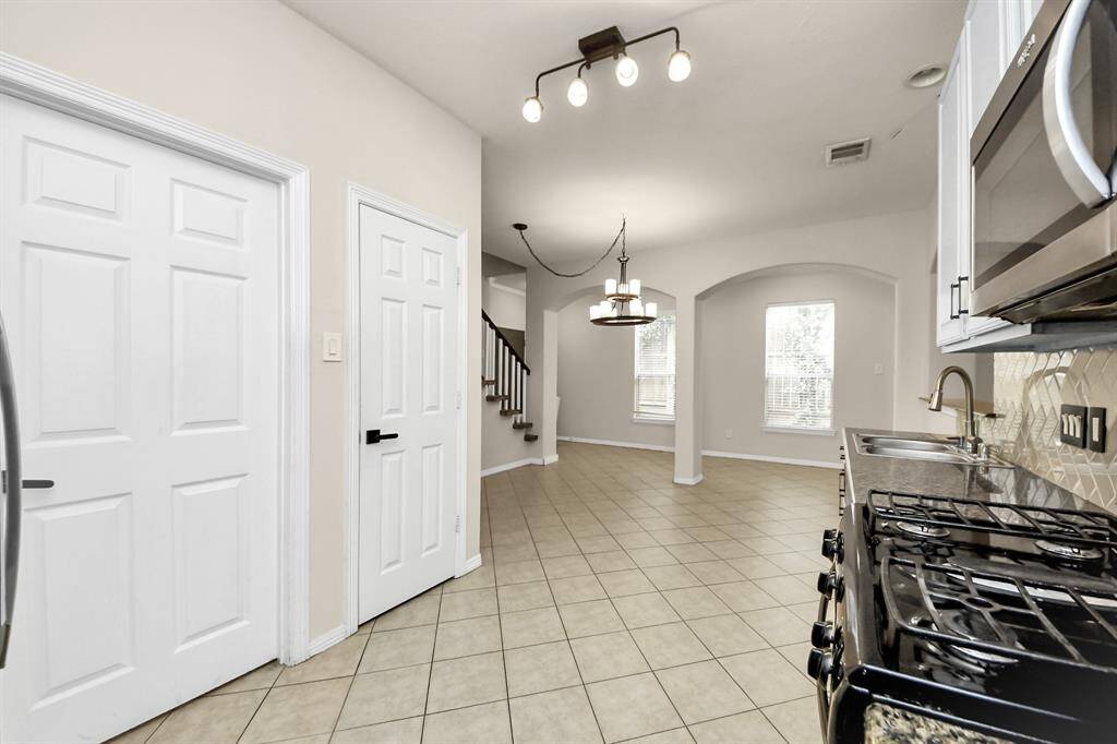 Dining area off of the kitchen with natural lighting.
