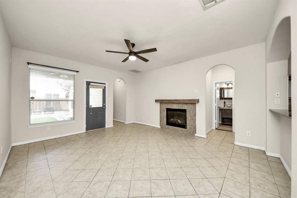 Spacious living area with an open layout, abundant natural light, and a comfortable, inviting atmosphere.