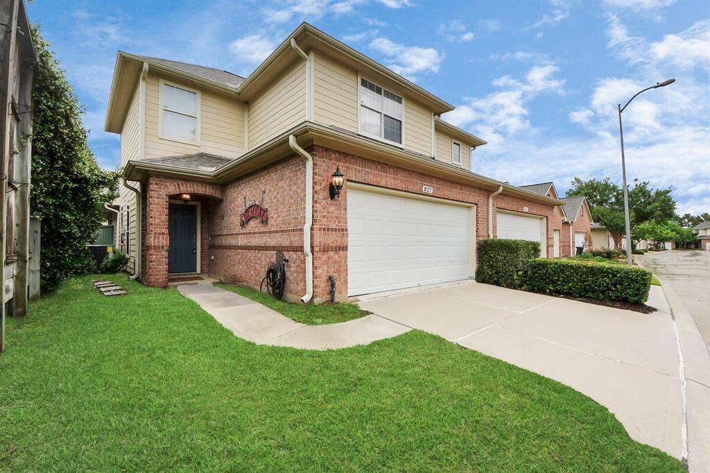 Welcoming front yard with lush green space, creating a serene and inviting first impression.