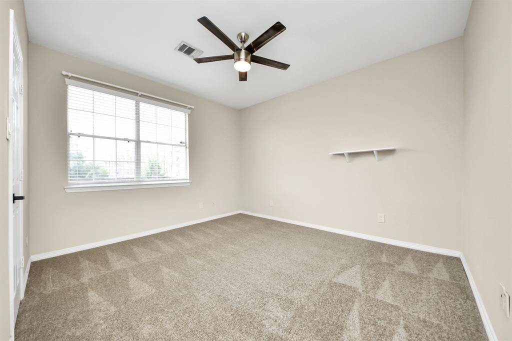 Comfortable secondary bedroom, perfect for family members or guests.