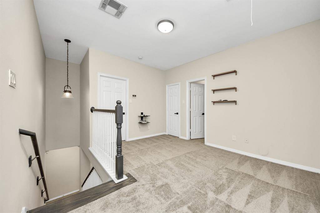 Versatile upstairs flex area, perfect for a home office, playroom, or additional living space.