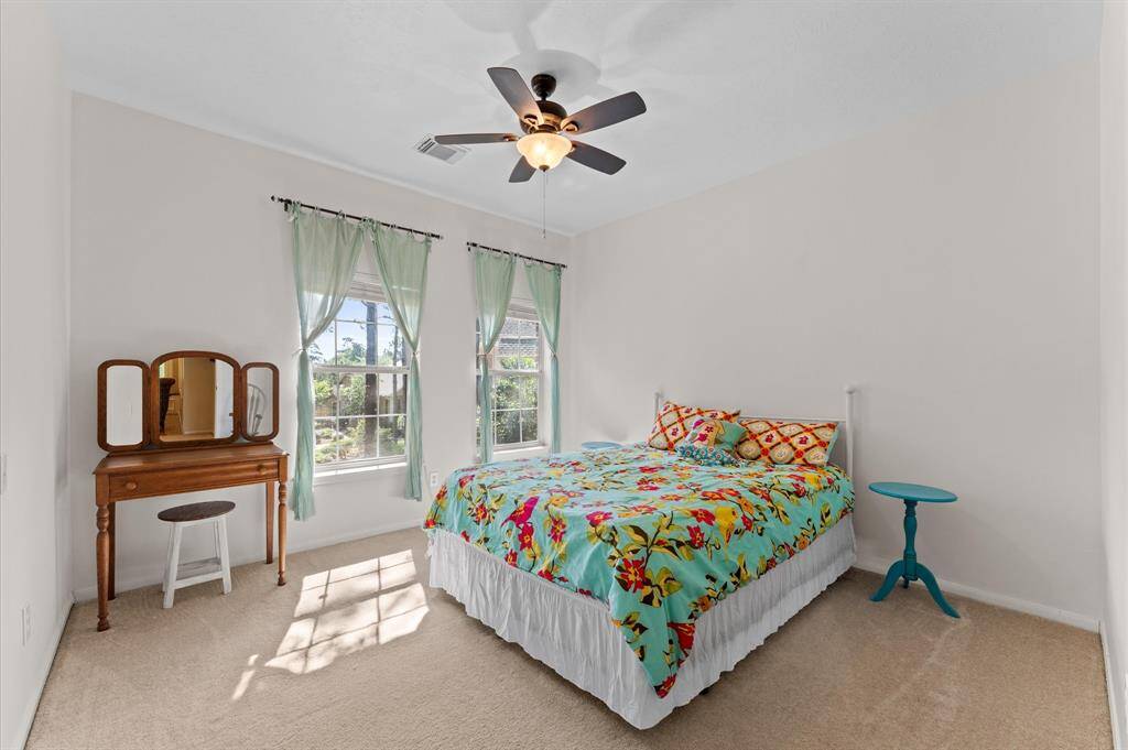 Spacious secondary bedroom with ample natural light.