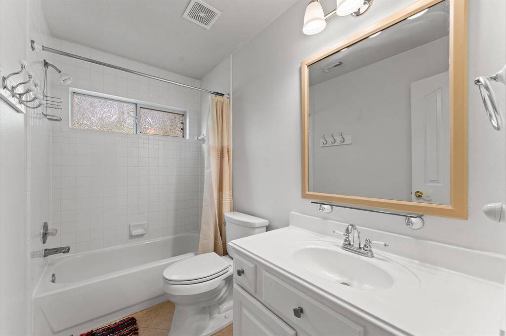 Convenient full bath next to bedroom.
