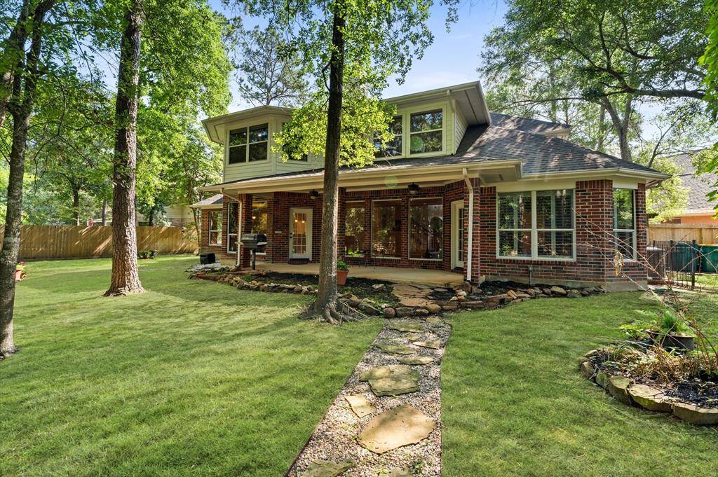 Enjoy outdoor living with a spacious covered patio and built-in gas grill.