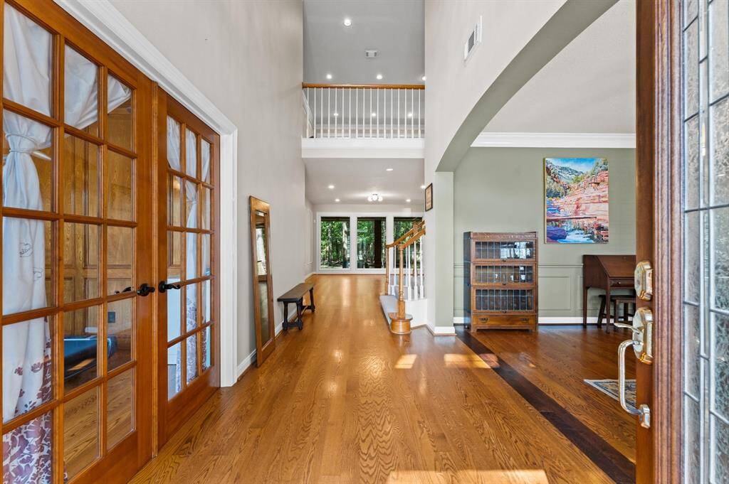 Elegant hardwood floors throughout the entire downstairs area and primary bedroom.