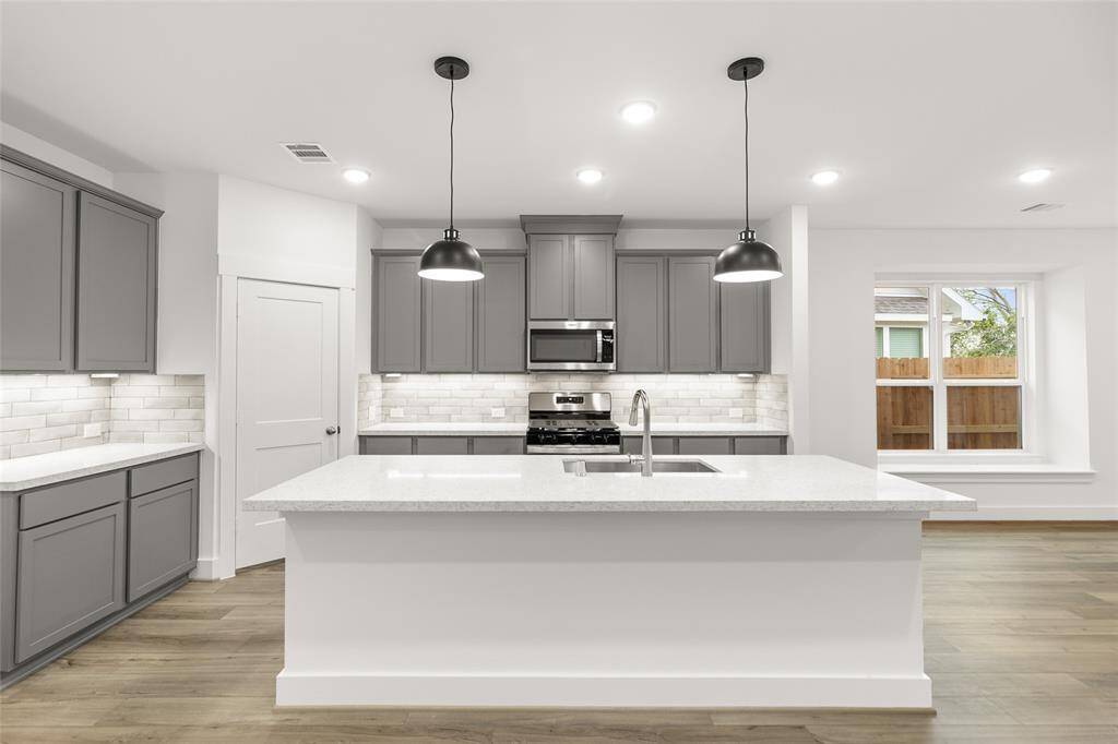 With its seamless layout and airy design, the kitchen invites effortless cooking, conversation, and connection.