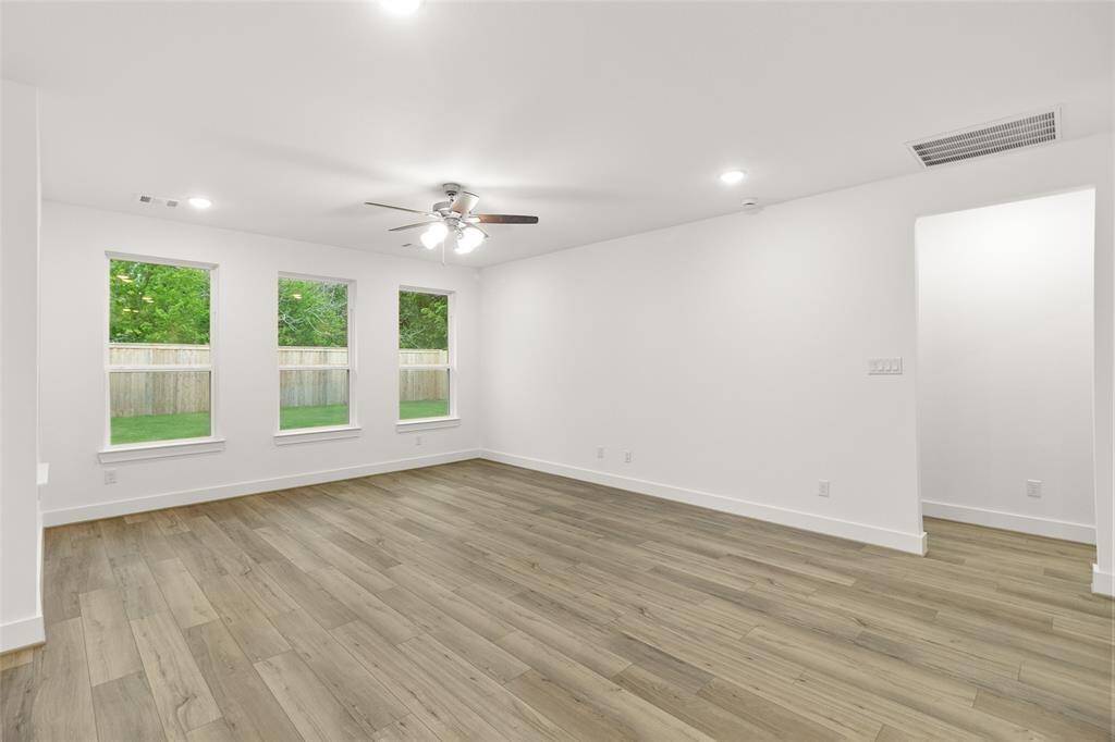 The spacious living and dining area flows together beautifully, creating an inviting atmosphere perfect for both relaxation and entertaining.