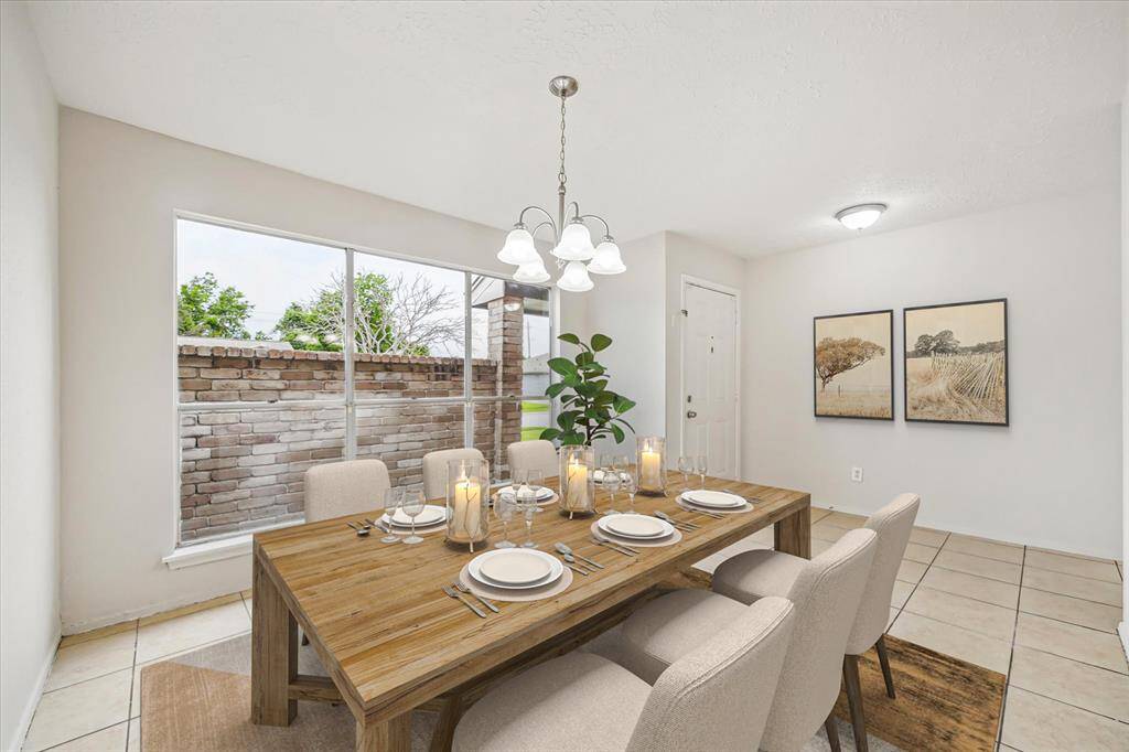 Virtually staged dining room showcases large windows allowing plenty of natural light