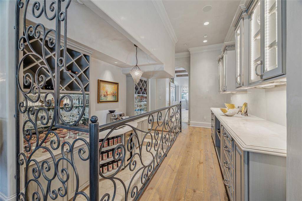 Sunken bar with wine fridge, butler's pantry and great storage.