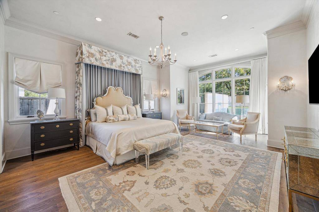 Primary down with large sitting area, pool access and abundant light.