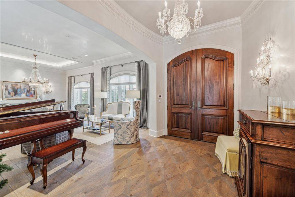 Stunning entry with Segreto venetian plaster, and custom floor pattern.