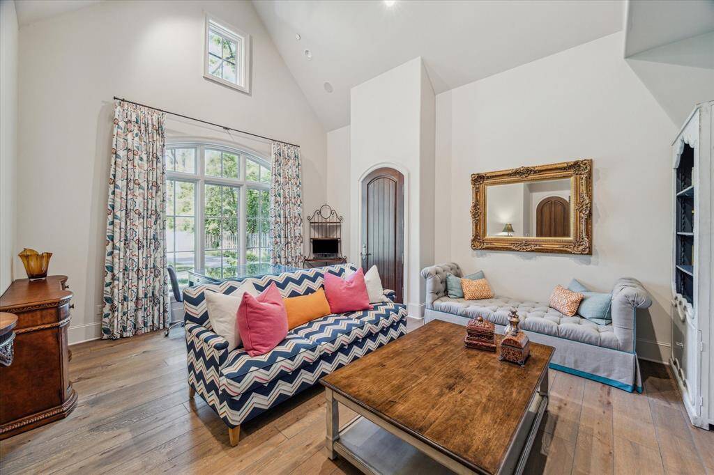 Guest suite down with vaulted ceiling, private entrance and separate gated driveway entrance.
