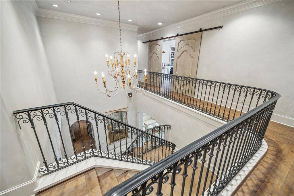 Second floor landing with stylish doors leading to the gameroom.