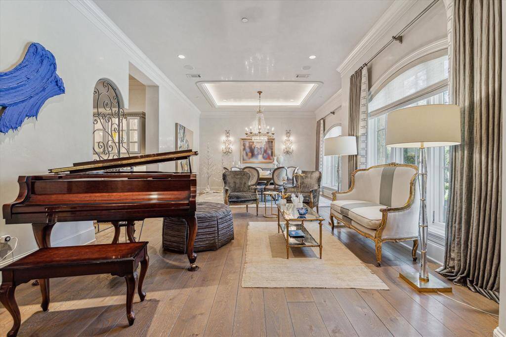 The living room and dining room seamlessly connect and are flooded with natural light.