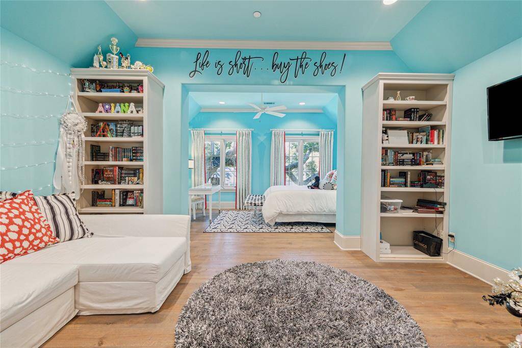 Third luxurious suite with fun sitting room including bookshelves and storage closet.