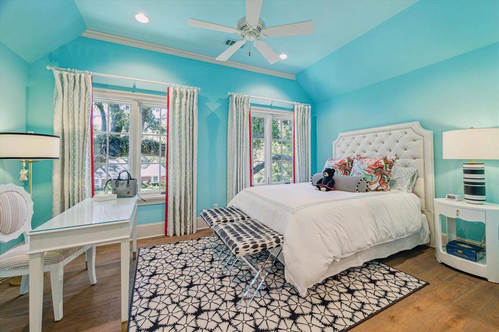 Light filled bedroom with vaulted ceiling.