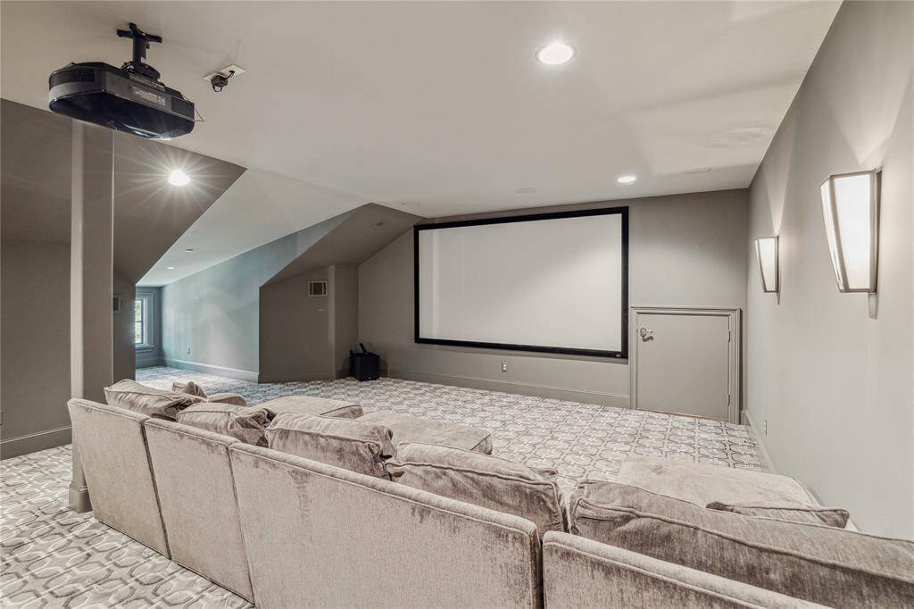 The media room is tucked away on the third floor with plush carpet and stylish colors.