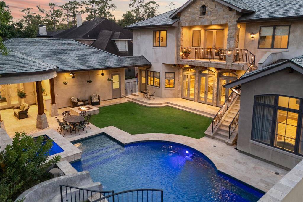 This backyard has it all with dimensional pool including, spa, water slide, tanning ledge and water wall.