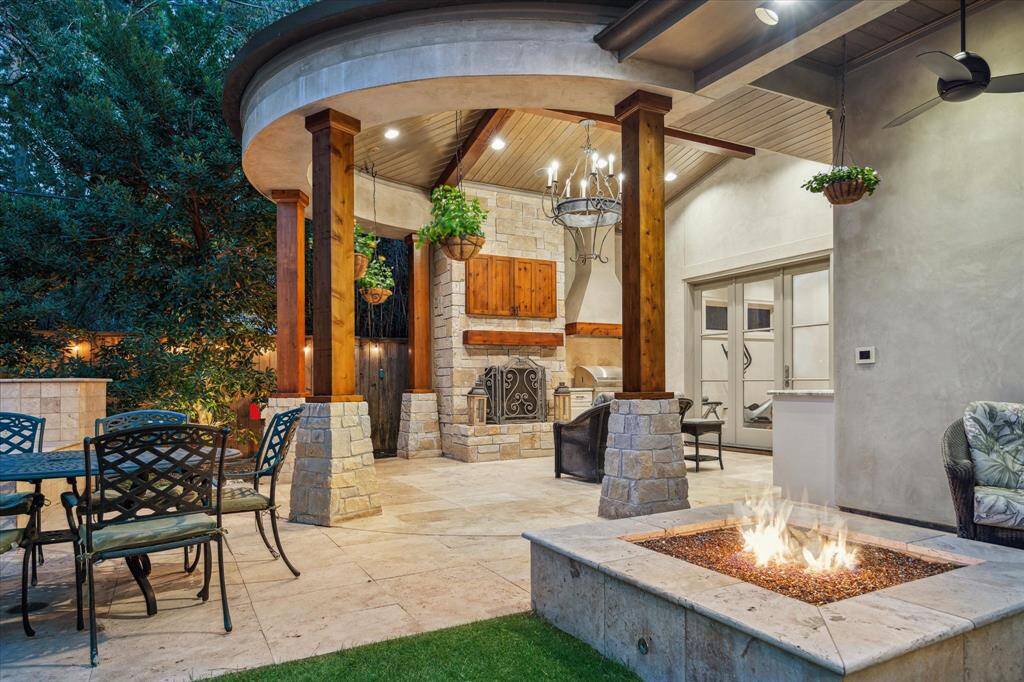 The outdoor living space includes a pavilion, fire pit and   outdoor dining patio.