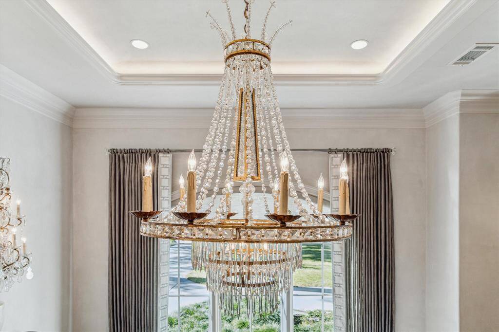 The lovely dining room chandelier is the centerpiece of the room.