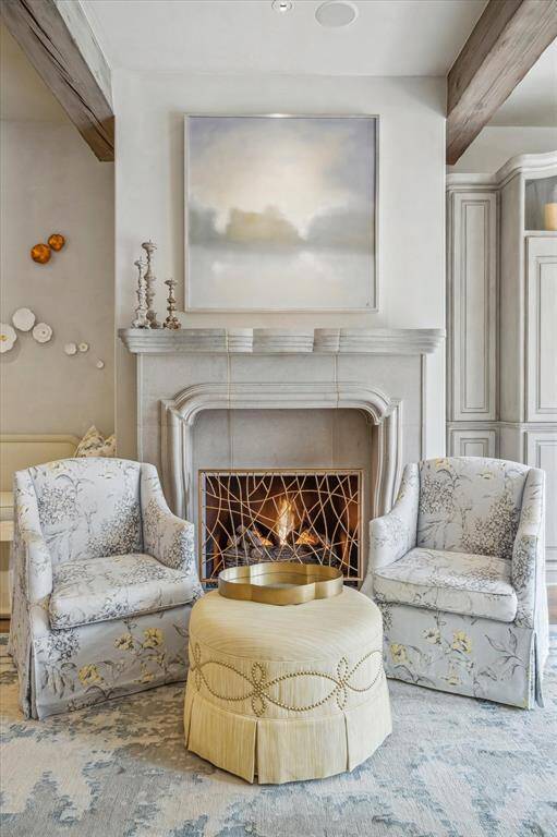 Cozy fireplace with stone mantel.