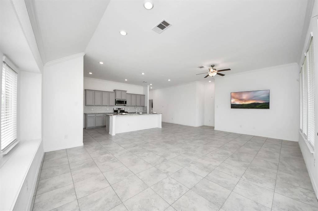 Seamless flow from dining to kitchen and living areas.