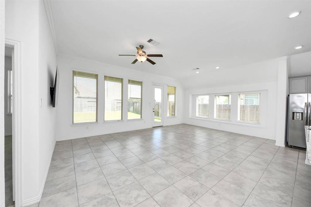 Experience the warmth of abundant natural light streaming through expansive windows.