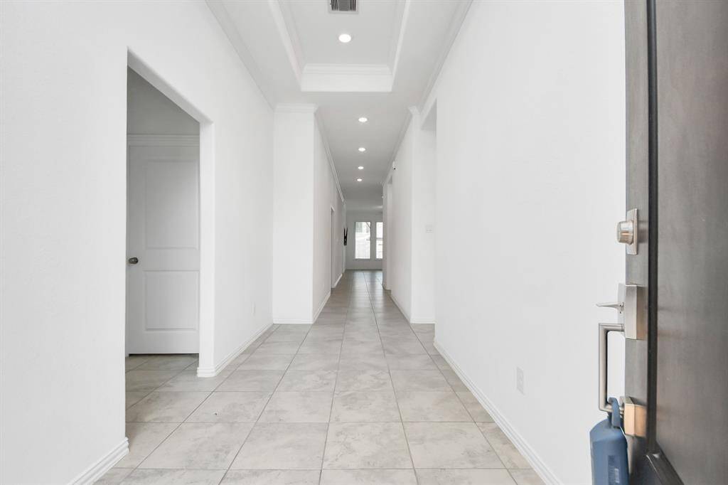 Welcome to an elegant foyer that sets the tone for this stunning home.