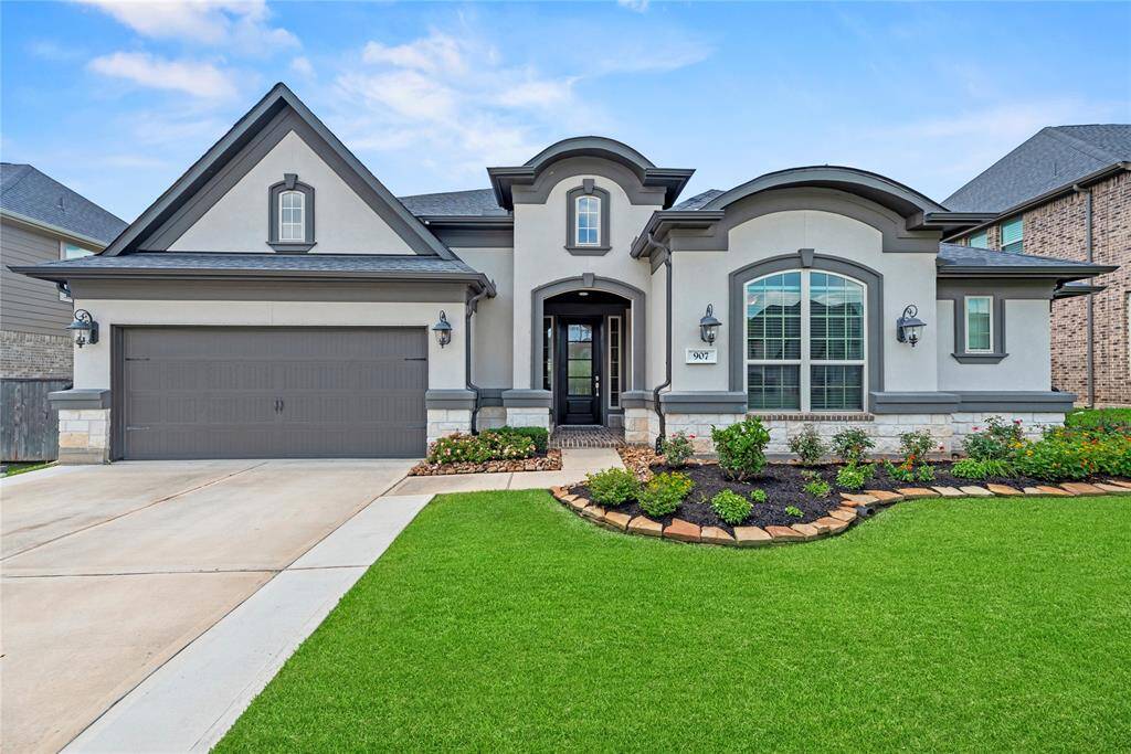 Welcome home to 907 Falcon Hollow Lane, nestled in the prestigious Woodtrace community!