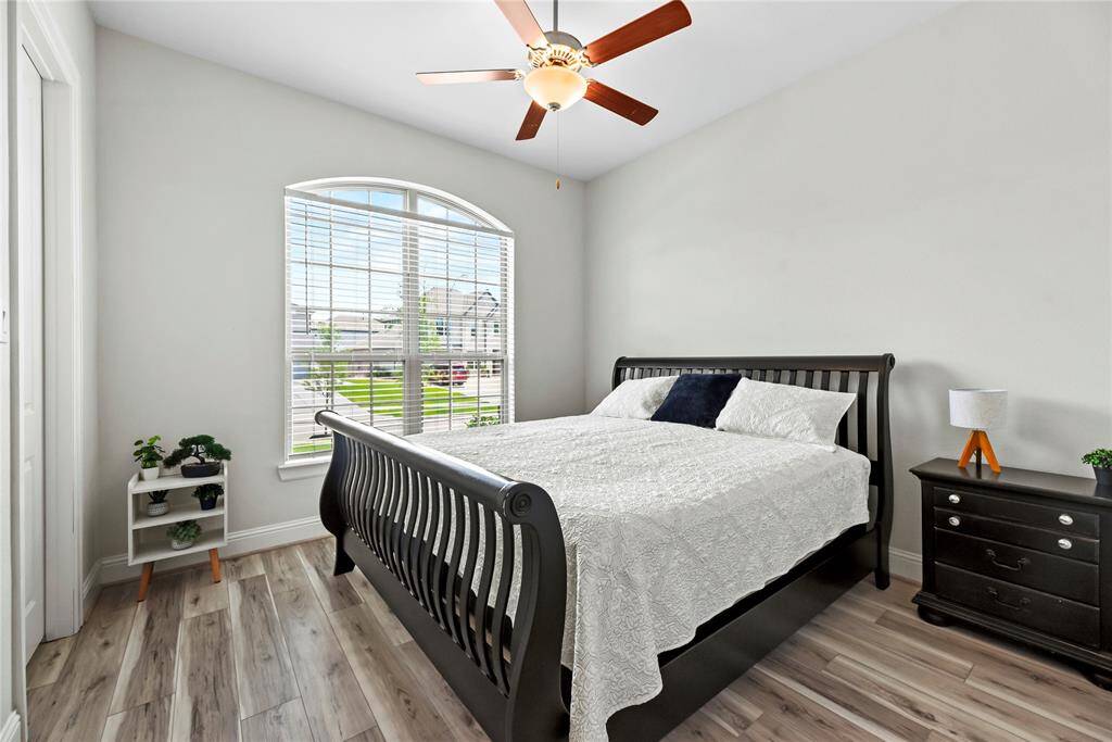 The thoughtfully designed layout of your fourth bedroom allows for natural light to flood the room, creating a warm and welcoming atmosphere.
