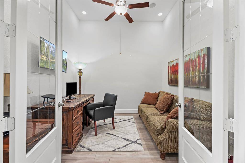 A private study through double glass doors adds a touch of sophistication and privacy to the home. It suggests a space dedicated to concentration, creativity, and productivity.