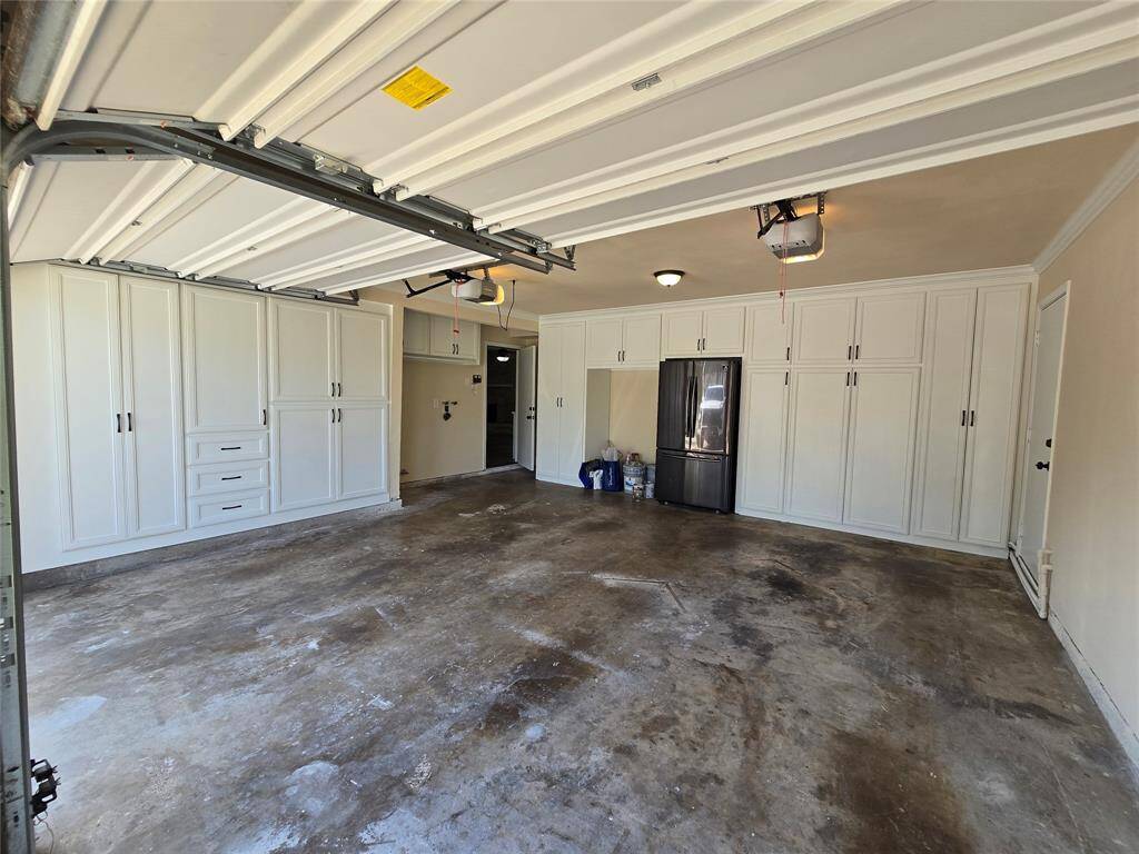 Dream garage with lots of storage and refrigerator