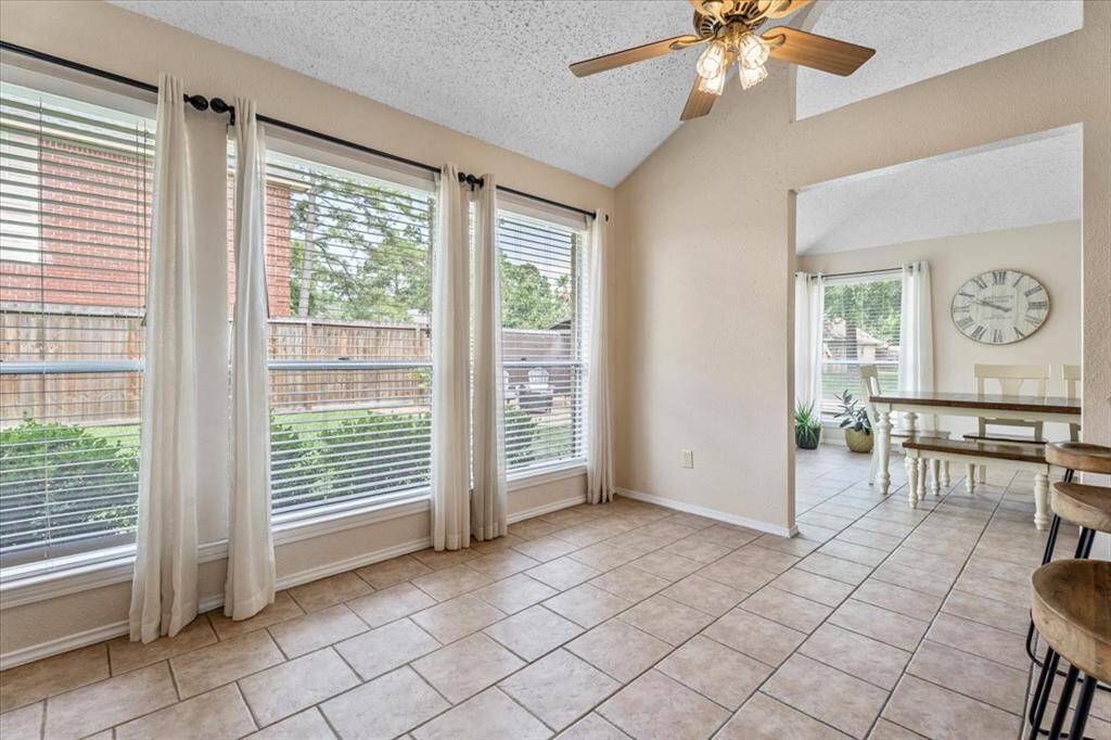 Enjoy your morning coffee in this charming breakfast nook, or use it as additional seating that flows seamlessly from the living room.