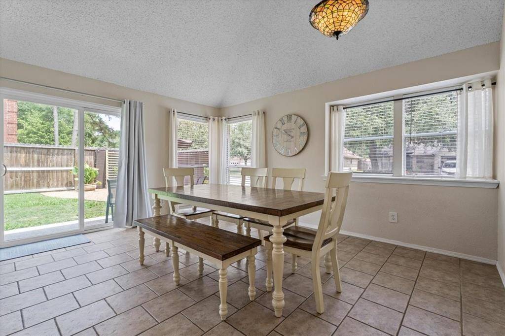The formal dining area is spacious and conveniently located just off the kitchen, making it perfect for hosting dinners and special occasions.