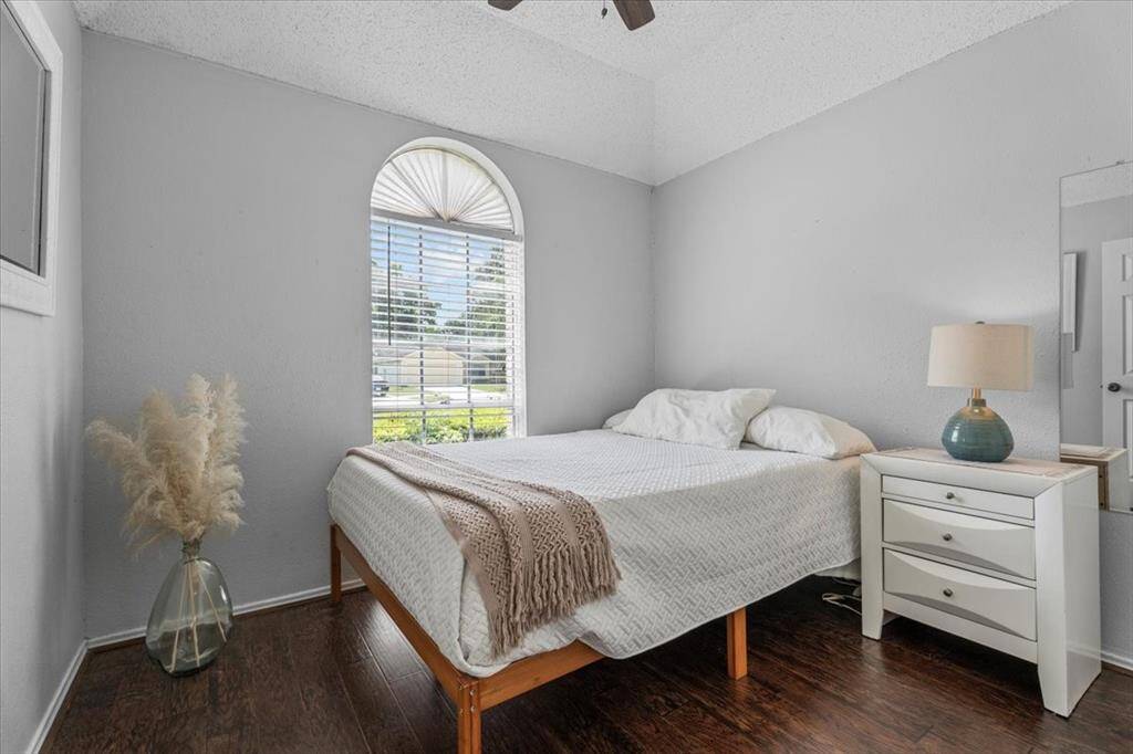 This secondary bedroom is filled with natural light, creating a bright and welcoming space.