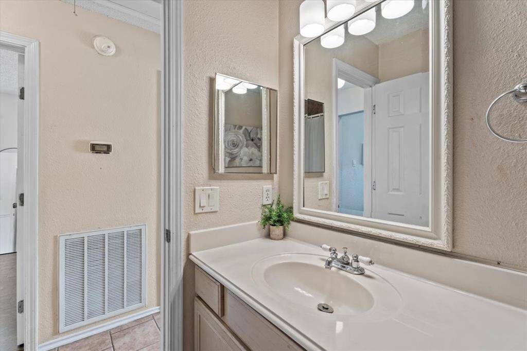 "The secondary full bath features a convenient tub-shower combo and is ideally located near the secondary bedrooms for easy access."