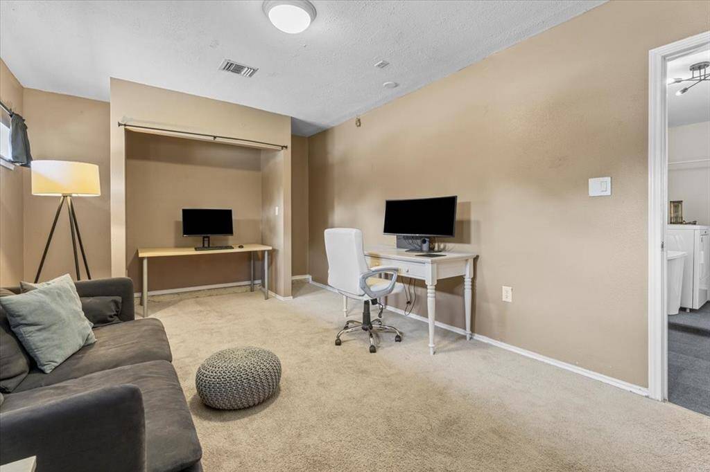 Formerly a two-car garage, this climate-controlled space offers endless possibilities—perfect as an additional bedroom, a home office, or a comfortable area for family and guests.