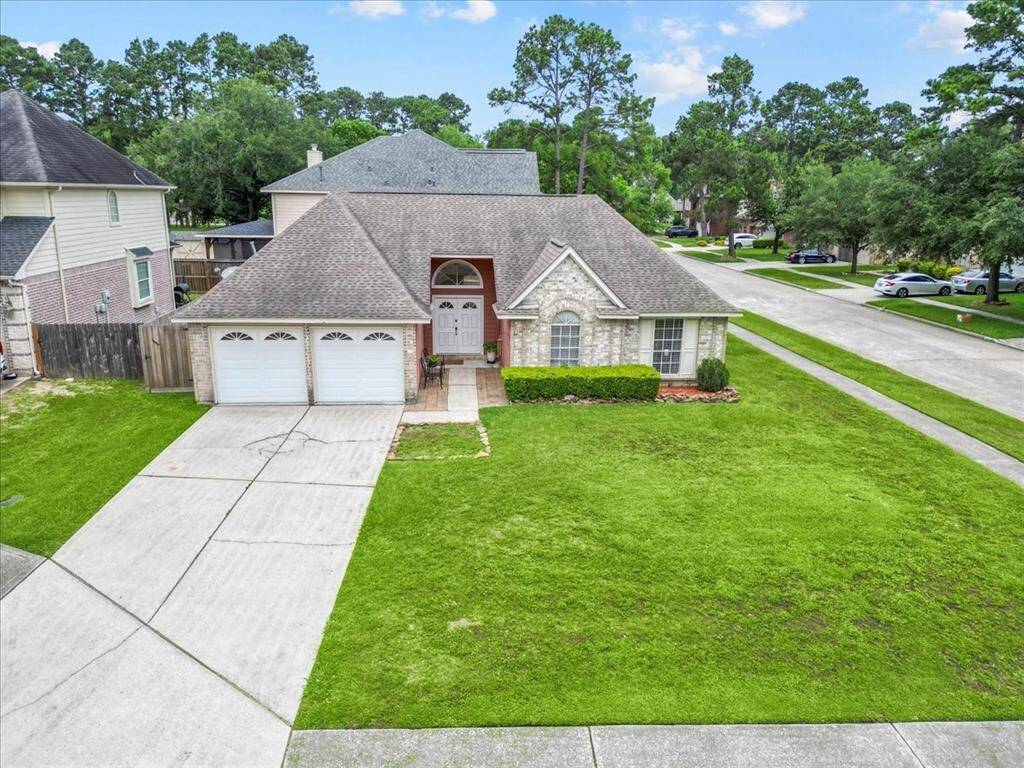Parking is never a problem with this home’s oversized driveway and additional curbside space.
