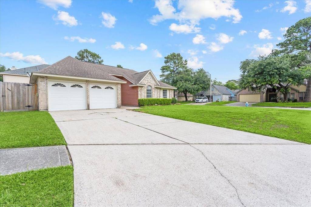 Parking is never a problem with this home’s oversized driveway and additional curbside space.