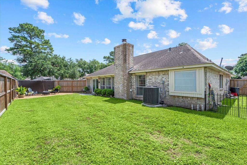 With plenty of room for kids and pets to run and play, this spacious backyard is perfect for outdoor fun and relaxation.