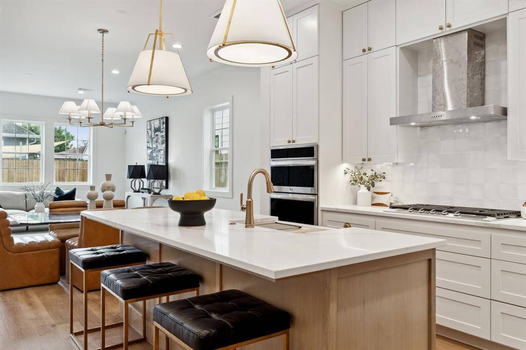 A bright, open-concept kitchen flows seamlessly into the living space—perfect for casual mornings or hosting a crowd.