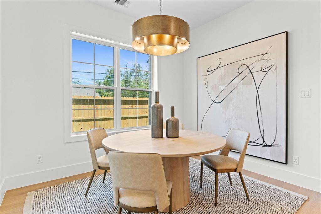 Natural light floods the breakfast nook, offering the ideal spot for slow mornings or casual dining.