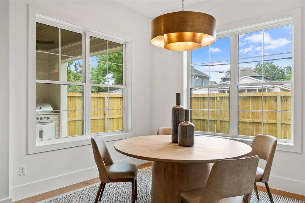Breakfast nook over looking the yard and outdoor kitchen.