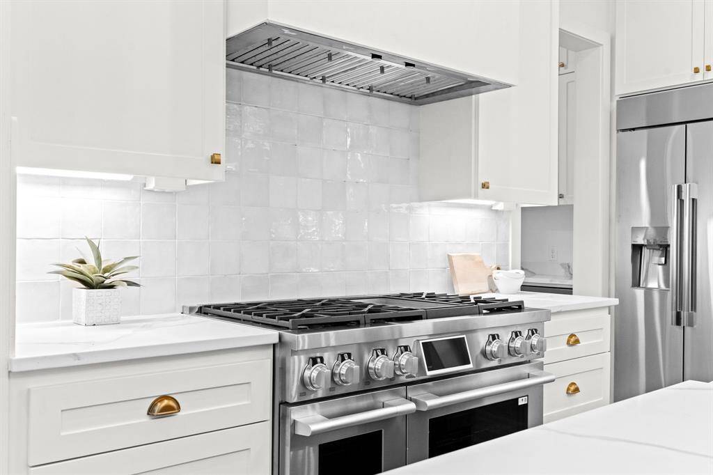Premium double ovens and a gas range anchor this culinary space