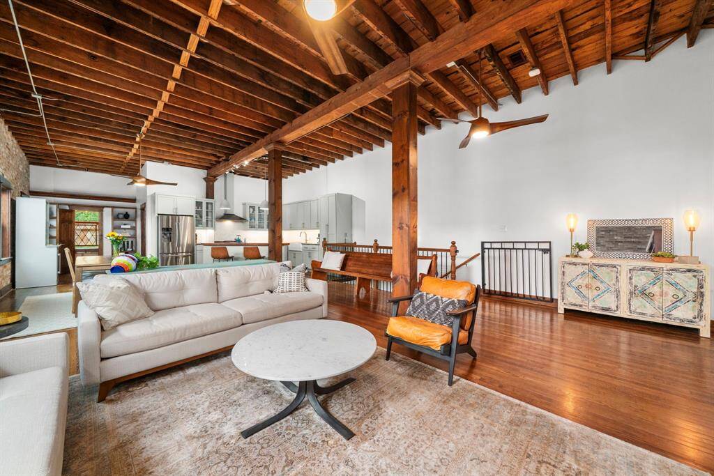 Enjoy soaring 12’ ceilings, exposed beams, original stained glass, and a preserved church pew from the 1940s.