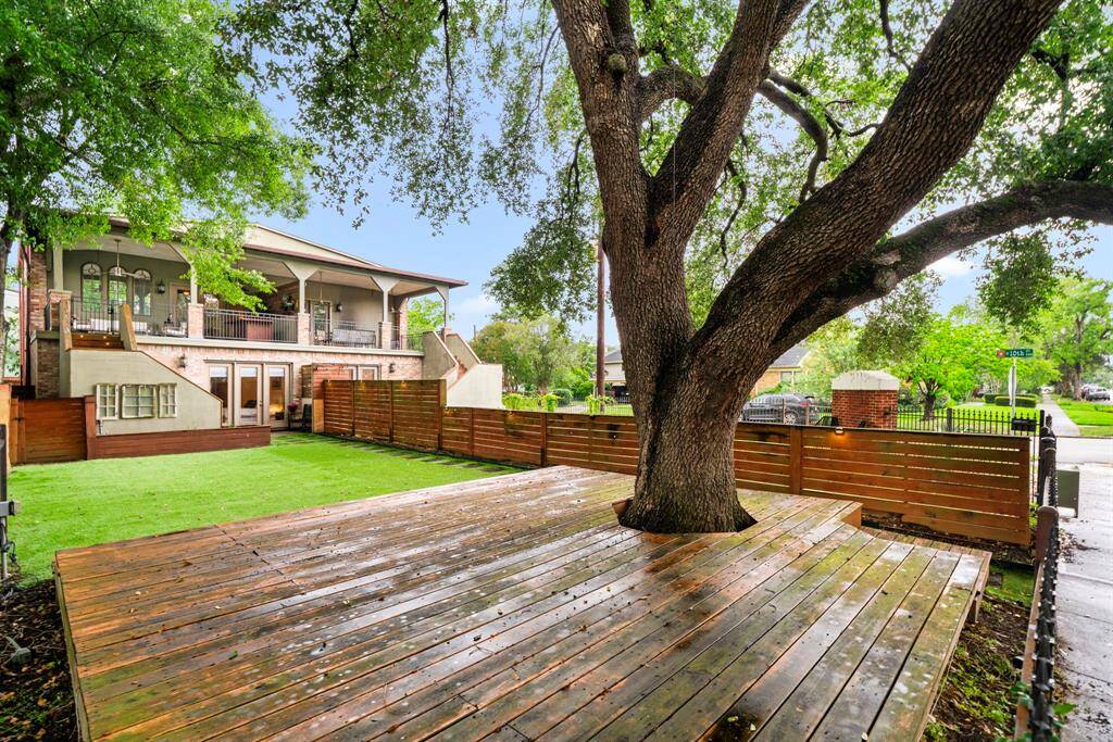 Incredible oak tree provides shade year-round for the low-maintenance turfed yard.