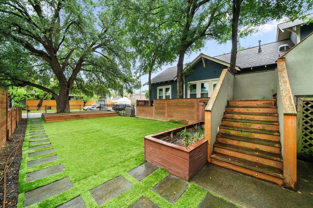 Zoned to acclaimed Harvard Elementary, this loft-style townhome blends rich history with modern luxury.