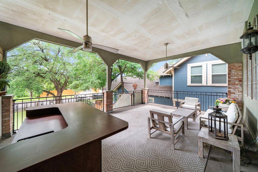 Massive covered patio off the main living floor with beautiful views of the turfed yard.
