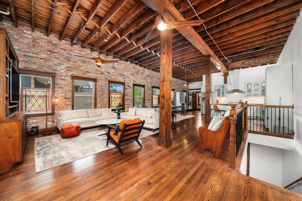 Enjoy soaring 12’ ceilings, exposed beams, original stained glass, and a preserved church pew from the 1940s.